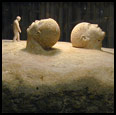 TWO HEADS AND A FIGURE - 2006 - Quartzite - 41" x 59" x 48" - Collection of the artist